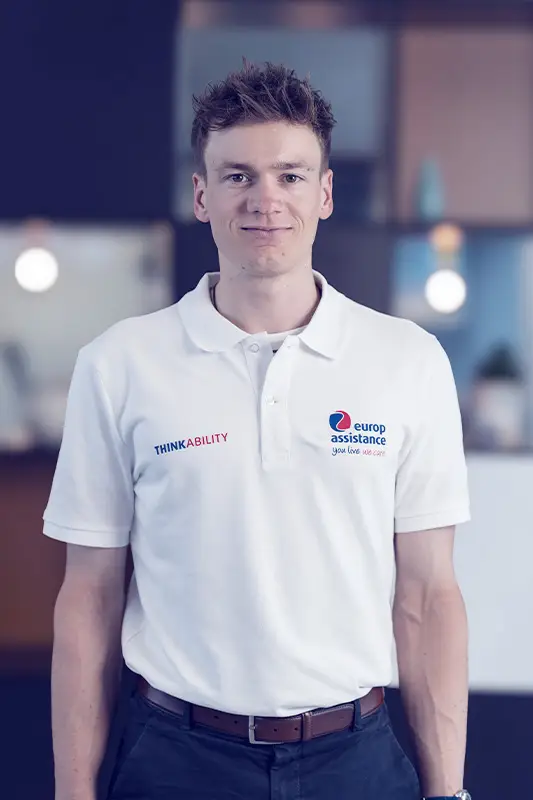 “White polo shirt with Europ Assistance logo and ThinkAbility branding