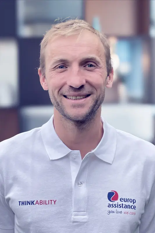 White polo shirt with Europ Assistance logo and ThinkAbility branding